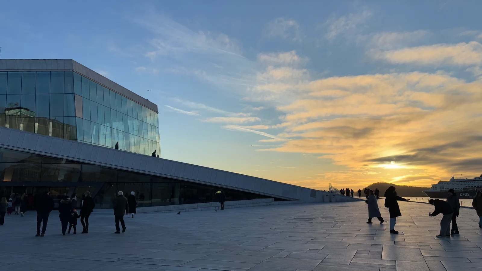 Oslo Opera House beside the waterfront at sunset
